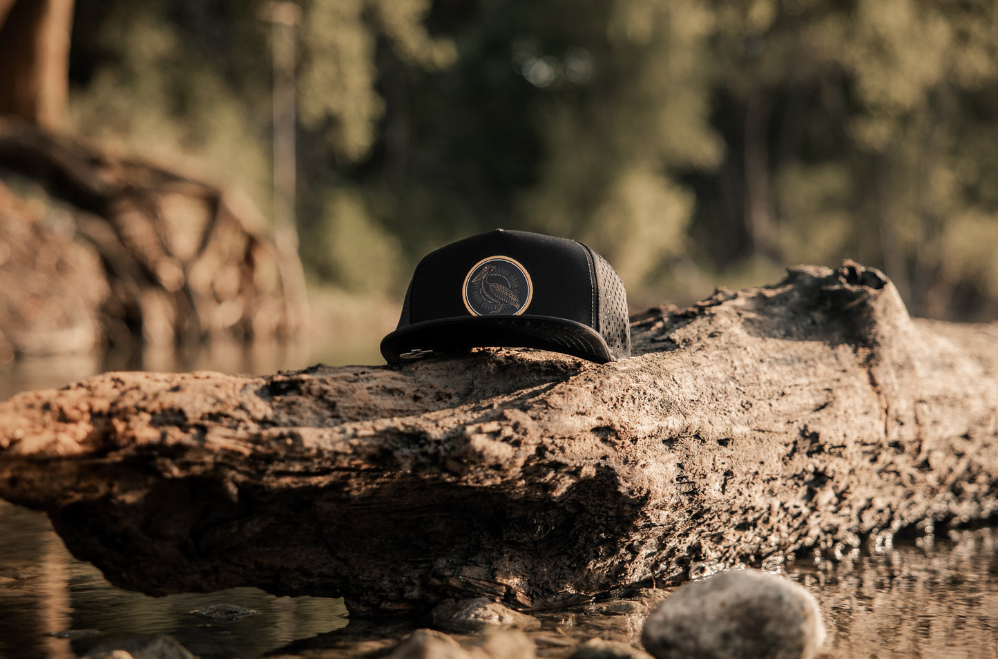 Custom black five panel snapback with yellow pelican patch and rope